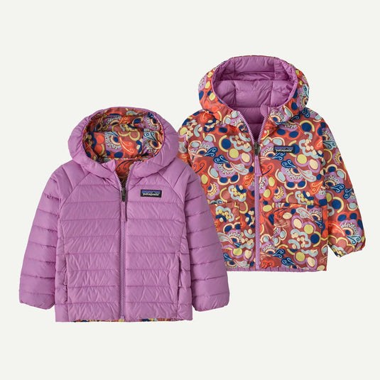 Two children's jackets with colorful patterns on a white background