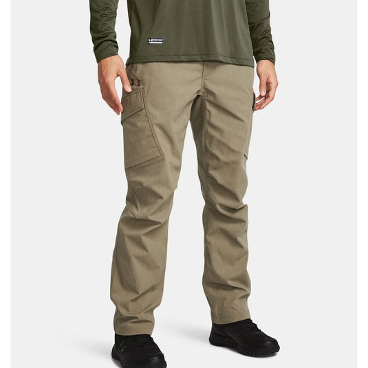 Person wearing khaki pants and a green shirt on a white background