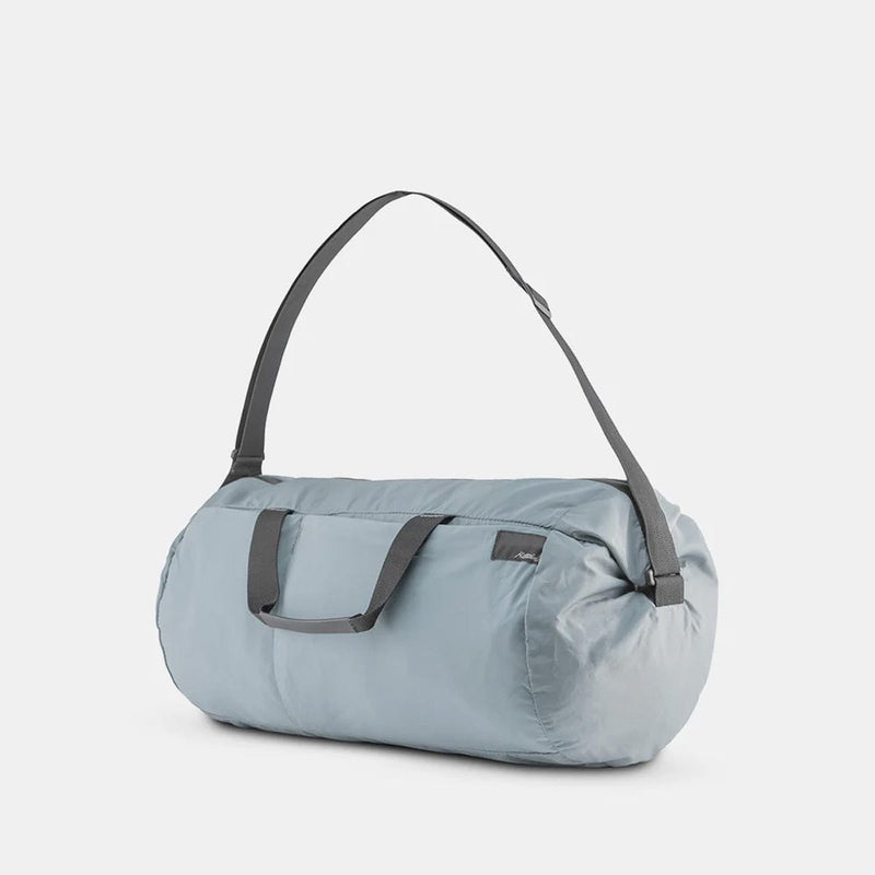 Load image into Gallery viewer, Light blue duffel bag with gray straps on a white background