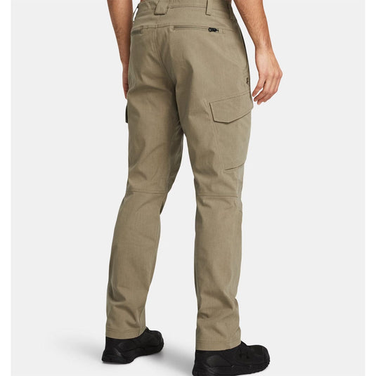 Beige pants worn by a person on a white background