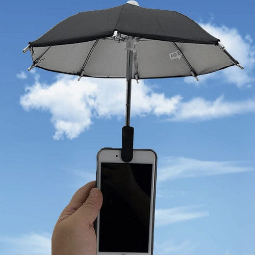 Smartphone with a small umbrella attached against a blue sky background